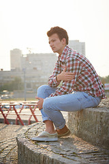 Image showing Handsome man sitting outdoors