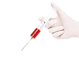 Image showing Hands of the doctors filling a syringe 