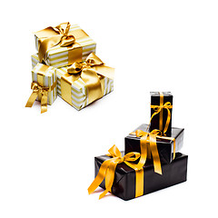 Image showing gift boxes with yellow satin ribbon and bow