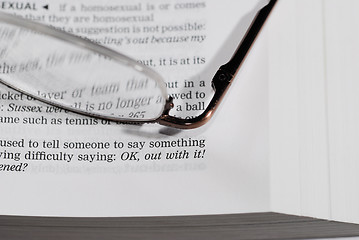 Image showing glasses on book