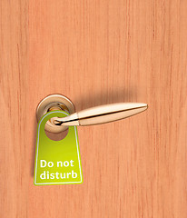 Image showing Hotel wood door with a Do not disturb sign