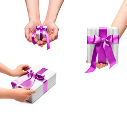 Image showing male holding gift boxes with a bow