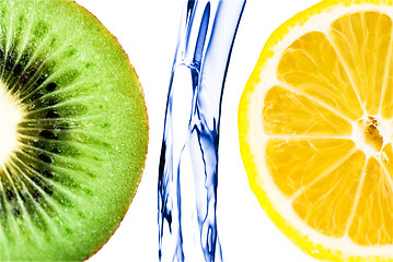 Image showing sliced lime with lemon splashing in water isolated