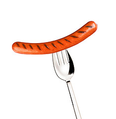 Image showing Close-up of fried sausage on a fork