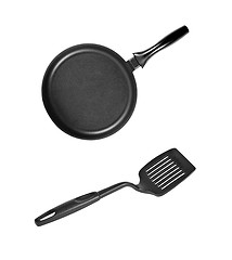 Image showing Pan with black plastic kitchen spatula