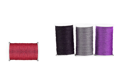 Image showing Colourful spools of thread isolated on white background