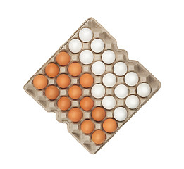 Image showing twenty four of white and brown eggs in the box