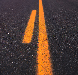 Image showing Asphalt road texture with yellow stripe