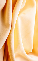 Image showing background of bright yellow silk with waves