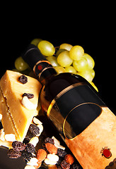 Image showing red wine bottle with grape and cheese