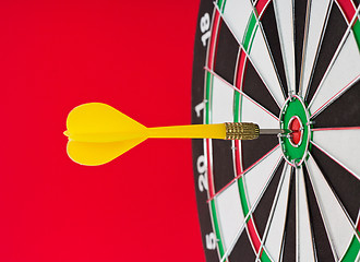 Image showing Dart sticks to bullseye