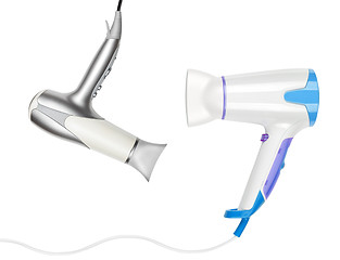 Image showing Two hairdryers isolated on white