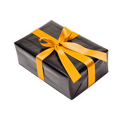 Image showing Black gift box with yellow satin ribbon and bow