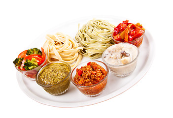 Image showing two italian tagliatelles and five various condiments