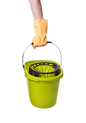 Image showing Human hand holding empty plastic bucket container