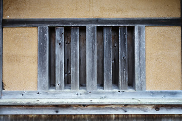 Image showing Old cabin house with wooden window