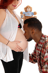 Image showing Man kissing wives belly.