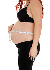 Image showing Pregnant woman measuring belly.