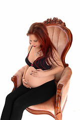 Image showing Pregnant woman in armchair.