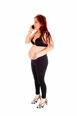 Image showing Pregnant woman on cell phone.
