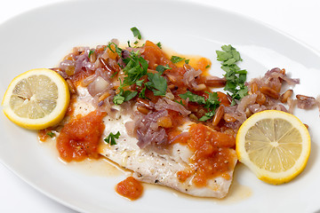 Image showing Baked fish with tomato sauce, onion, pine nuts