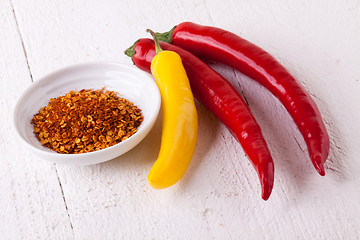 Image showing Fresh red and yellow chili peppers with spice