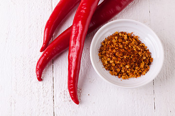 Image showing Fresh red and yellow chili peppers with spice