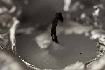 Image showing Burnt extinguished wick on a candle