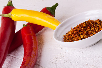 Image showing Fresh red and yellow chili peppers with spice