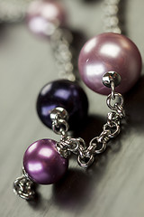 Image showing Attractive shiny purple beads on jewellery