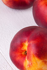 Image showing Three tasty fresh ripe juicy nectarines