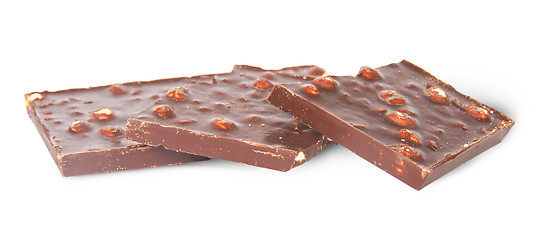 Image showing Several pieces of dark chocolate with hazelnuts