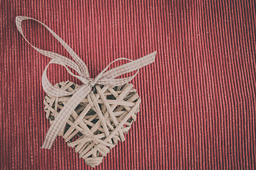 Image showing valentine's wooden hearts on a fabric background in retro color