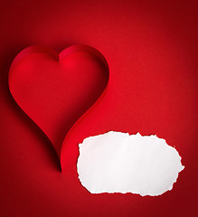 Image showing valentine's paper hearts on a red background