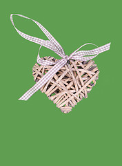 Image showing valentine's wooden hearts isolated on green background