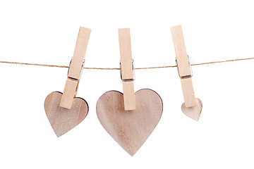 Image showing wooden heart hanging on the clothesline