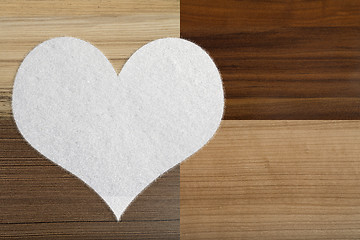 Image showing valentine's snow hearts on a wooden background