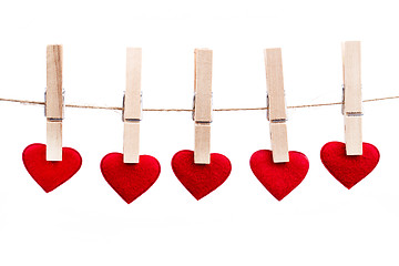 Image showing Red fabric heart hanging on the clothesline