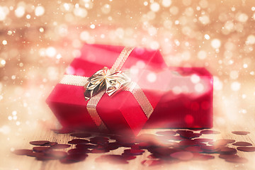 Image showing Red hearts confetti on abstract bokeh background