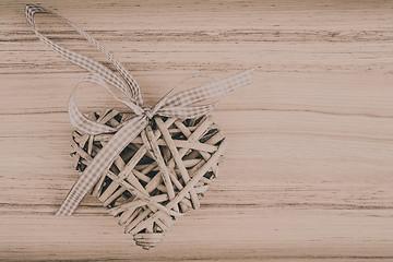 Image showing valentine's wooden hearts on a wooden background in retro color