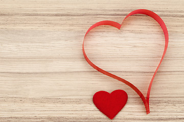 Image showing valentine's paper hearts on a wooden background