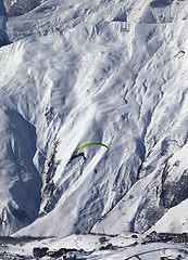 Image showing Speed flying in snow mountains in sun nice day