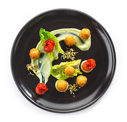 Image showing Plate of cheese balls and vegetables