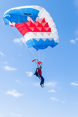 Image showing Paratrooper girl descends