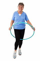 Image showing Senior woman with hula-hoop