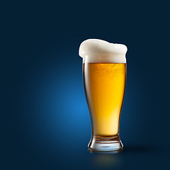 Image showing Beer in glass on blue