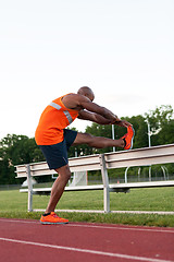 Image showing Track and Field Runner Stretching