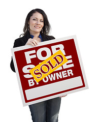 Image showing Hispanic Woman Holding Sold For Sale By Owner Sign