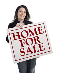 Image showing Hispanic Woman Holding Home For Sale Real Estate Sign