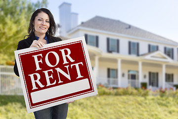 Image showing Hispanic Female Holding For Rent Sign In Front of House